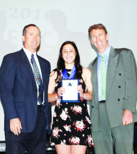 Katya Dondi received recognition as Junior Girls' Athlete of the Year from former principal Kent Armstrong and Angus Doughty.