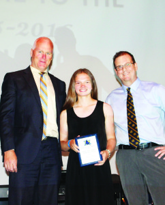 Principal James Kardash and Jon Forbes presented the plaque to Bryn Ferris, senior girls' athlete of the year.