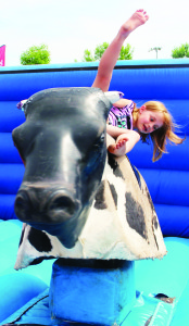 There was a line-up to get to ride this mechanical bull. Cayla Ransom of Alton wasn't able to stay on it very long.