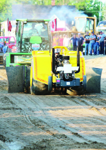 Paul Truax of Angus turned in a pull of 302.87 feet driving this single-engine modified tractor called School's Out. Photos by Bill Rea