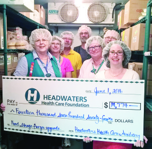 Carolyne Beaton, Tannis Sherwood, Jim Aijala, Mike Cater, Linda Jameson, Ted Buckett and Christine Hann with the cheque to Headwaters Foundation.