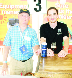 Rotarian Ian Kittle was helping Connor Russell serve products from Hockley Brewery.