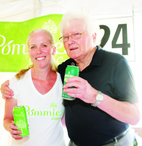 Lindsay Sutcliffe was offering samples of the products from Pommies Cider Co. with Rotarian Michael Lawler.
