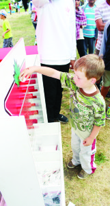 Anthony Holody, 4, of Brampton was trying his skill at one of the games in the Canadian Tire Fun Zone.