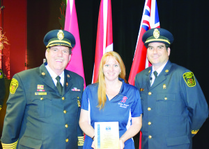 Laura Boughen, representing the Bolton Braves, recently accepted the 2016 Fire Safety Award for their contribution toward fire safety awareness in the community. Caledon's Fire Chief David Forfar and Chief Fire Prevention Officer Dave Pelayo were on hand for the presentation.