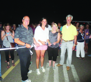 Mayor Allan Thompson was joined by Councillor Johanna Downey, Dufferin-Caledon MPP Sylvia Jones and Brampton Flying Club President Chris Pulley in cutting the ribbon to officially start last Thursday's Light Up the Runway. Photo by Bill Rea