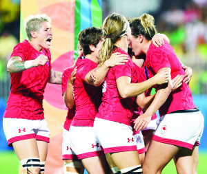 Bolton's Kelly Russell (far right) celebrates a bronze medal performance with the Canadian rugby sevens team in Rio Monday. Photo courtesy of Canadian Olympic Committee