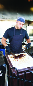 George Kaalitzis was cutting up an order prepared at Jack the Ribber.