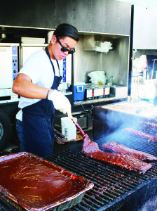 Joey Vo was putting plenty of sauce on the ribs at Dinosaur BBQ Pit.