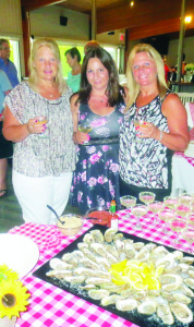 Dawn Scaccia from New York (left), her sister Danita Taccogna of Caledon (right) and Kris Passera of Bolton (middle) were sampling a Spanish sparkling wine accompanied by PEI Malpaque oysters. Photos by Bill Rea