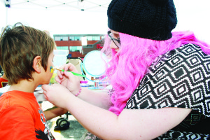 There were opportunities for face painting. Sam Morra was working on a design for Pietro Rancati, 8, of Bolton.