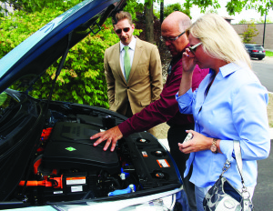 Chad Heard, senior manager of public relations with Hyundai, was giving Mayor Allan Thompson and Councillor Jennifer Innis a look under the hood of this hydrogen-powered Hyundai Tucson. Photo by Bill Rea