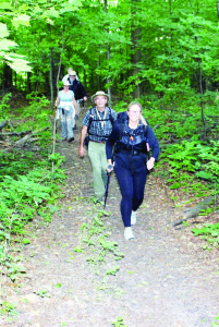 TREK ON OAK RIDGES MORAINE TRAIL STARTED AND FINISHED Aurora resident Kelly Mathews had a crew of supporters out to join her early last Sunday morning as she set off on her 300-kilometre walk along the Oak Ridges Trail. She walked roughly the equivalent of a marathon each day, and completed the journey at Trent Hills near Brighton. The hike was a fundraising effort for Seneca's King Campus expansion and the Oak Ridges Trail Association (ORTA). Mathews is the manager of community recreation, camps and the Outdoor Education Centre at Seneca College on Lake Seneca. The target was to raise $5,000, but she had already passed that goal. “I'm just pennies under 8,000 right now,” she said as she started off. Accompanying her at the start Brian Millage, regional director of ORTA, his wife Wilma, Frank Alexander of ORTA and ORTA President Kevin Lowe. Photo by Bill Rea