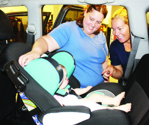 CHILD CAR SEAT CLINIC IN BOLTON Caledon OPP Auxiliary officers recently held the latest of their child car seat clinics at the Fire Hall in Bolton. Peel Regional Police Auxiliary Constable Laura Peel was showing Sandra Marino of Brampton how to adjust the seat for her 10-month-old daughter Sara Menendez. The next clinic will be Sept. 27 from 6:30 to 9:30 p.m. at the Bolton Fire Hall at 28 Ann St. It will be by appointment only. Call 905-584-2241 to book an appointment. Photo by Bill Rea