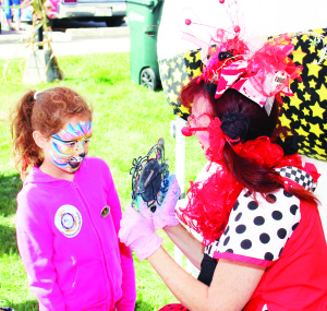 There was face painting provided by Clowns at Party California. Jillian Dixon-Jenkins, 7, from Erin was giving her approval to the work of Doodlebug.