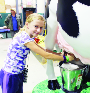 Samantha Flatley, 9, of Brampton had the chance to see what it's like to milk a cow with this machine.
