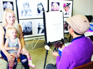 There were opportunities for people at the fair to have their portraits done. Da Rong Dong of Portrait For you Art Studio was working on the drawing of Makenzie Sturge, 2, of Brampton while she was held by her mother Sienna Collins.