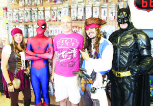 HEROES AND PIRATES HELP OPEN  NOBLETOYZ Derrick Noble, of Nobletoyz Toys and Collectibles had a lot of support Saturday for the gran opening of his business on Healey Road in Bolton. The store actually opened earlier this month, and he said he's already been getting a lot of repeat business. “Today's been phenomenal,” he declared, adding it's also been a lot of fun. Photo by Bill Rea