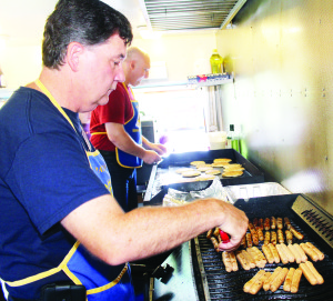 The Rotary Club welcomed participants with a pancake breakfast. Rotarians Derek Clark and Dan Petre were working in the chip wagon.