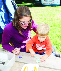 There were some crafts for the younger folks to work on. Jakob Fuchs, 2, of Brampton got some help from his mother Christine as he worked on creating a watershed animal totem stone. His work depicted a wolf.