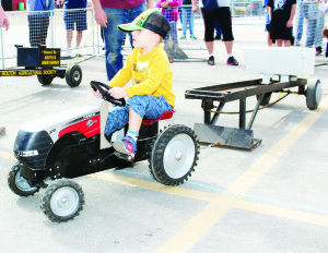 Matthew Gray River, 3, of Bolton was giving it all he had in the Kiddie Pedal Pull.