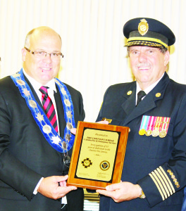 Mayor Allan Thompson presented this plaque to retiring Fire Chief David Forfar at Monday night's presentation of Canadian and Provincial Exemplary and Long Service Medals in Caledon East.