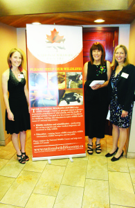WILDLIFE CENTRE HOSTS GALA The National Wildlife Centre (NWC), based in Caledon East, hosted its inaugural Gala Saturday evening at Devil's Pulpit Golf Club. NWC works to help native wildlife through programs aimed at conservation goals to protect ecosystems, populations of wild animals, and the health of individual animals. Veterinary Intern Dr. Sara Seemel and NWC founder Dr. Sherri Cox were flanking Hope Swinimer of the Hope for Wildlife TV show, who was one of the speakers at the event. Photo by Bill Rea