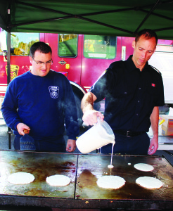 The Bolton firefighters hosted a Pancake Breakfast at their station on Ann Street Saturday to mark the start of Fire Prevention Week, which runs from Oct. 9 to Oct. 15. Firefighters Mark Sutton and John Nail were busy at the grill.