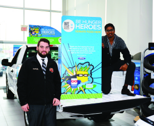 Fines Ford Lincoln Sales and Leasing Consultants Jess Di Domizio and Alex Singh will be challenging visitors to fill up the box of this Ford F 150 pickup truck with food donations during the Bolton dealership's We Scare Hunger event next Saturday (Oct. 29). Canadian Olympian champion Rosie MacLennan will be at the event with her gold medals and will be signing autographs. Food collected at the event will be donated to the Caledon Food Bank at Caledon Community Services. Photo by Brian Lockhart
