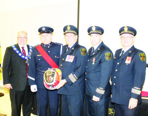 Darryl Thompson, president of Local 4686 of the Caledon Professional Fire fighters' Association, made a presentation to retiring Chief David Forfar, accompanied by Mayor Allan Thompson, Chief Darryl Bailey and Deputy Chief Mark Wallace.