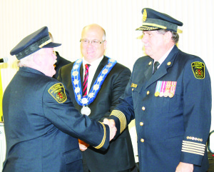 Mayor Allan Thompson and Fire Chief David Forfar congratulated District Chief Brian Zimmerman on his 45 years of service.