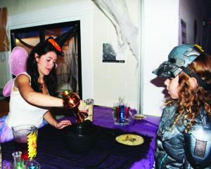 The Town of Caledon was right in with the Halloween spirit over the last week. They hosted events Friday night at Caledon Centre for Recreation and Wellness in Bolton, and Monday at Caledon Community Complex in Caledon East. Calista Iannotta was working at the Halloween Safe Night Monday. She was serving her Witch's Brew to customers like Ryker Skimming, 7, of Bolton. Photos by Bill Rea