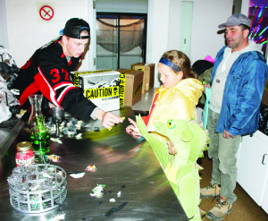 Gracie Smale, 9, and her brother Jacob, 7, of Caledon East were busy decorating pumpkins Monday at the Halloween Safe Night at Caledon East.