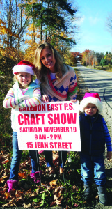 SIGNS OF CHRISTMAS Kate Honey, with her children Holly, 7, and Chase, 4, helped put out signs around town to promote Caledon East Public School's upcoming Craft Show. This 25th annual event takes place at the school Nov. 19 from 9 a.m. until 2 p.m. Get your holiday shopping done at the show, which will have more than 30 vendors with homemade crafts, a bake table and a giant silent auction. There will be lots for kids to do with a special kids shopping area as well as a visit and photos with Santa from 11 a.m. until 1 p.m. This event is a major fundraiser for the school. The school is at 15 Jean St. in Caledon East. For more information email cecsa.volunteer@gmail.com Submitted photo