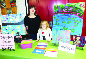 Sabrina Wojcik was assisting her Grade 3 daughter Hannah at the Inspirations of Hannah booth. The was selling calendars with her art, as well as paintings in acrylics and drawings.