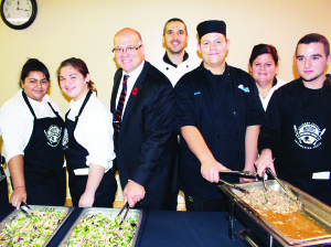 There was nothing wrong with the food at the recent Mayor's Business Lunch. Students from the various high schools in town pooled their culinary skills. These students from St. Michael Catholic Secondary School were working on home-made ricotta, drizzled with olive oil and thyme. Mayor Allan Thompson stepped in to help along the serving line.