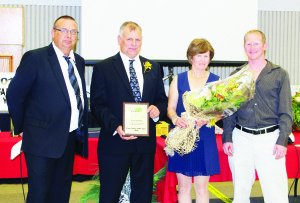 Peel Federation of Agriculture  President Keith Garrett congratulated Paul, Marion and Robert Kolb  of Mount Kolb Farms as Peel's Farm Family of the Year.