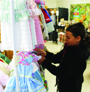 Mackenzie Cartwright, 10, of Mono was browsing through some of the doll's fashions made by Mae Desrocher of Inglewood.