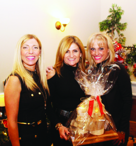 Caledon East residents Carol Caprara and Bonnie Tonon of Simply Piped Rustic and Industrial Design were flanking Anna Pilla of Kleinburg who had been looking at their merchandise.