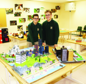 Grade 11 students Lucas Santos and Julian Ferreira are seen with some of the creations from the architectural design class.