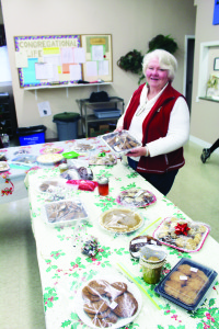 BAKE SALE AT CAVEN The items went fast recently at the Bake Sale at Caven Presbyterian Church in Bolton, but there were still some goodies available. Maureen Eberly was taking charge of the table. Photo by Bill Rea
