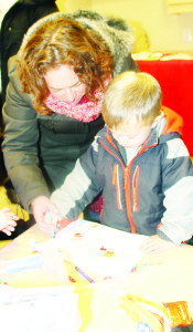 Village Child Care Centre, located inside the Church, had some fun crafts for youngsters to work on. Aliza Perlman of Toronto watched as her son Joshua, 3, worked on his creation.