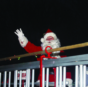 There was a large and warm reception waiting to greet Santa Claus Saturday evening after the Santa Claus Parade in Caledon village. St. Nick rode through the streets to the tree lighting outside Knox United Church. Photos by Bill Rea