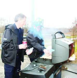 Firefighters in the holiday spirit Inglewood Fire Fighters are holding their sixth annual Fill a Fire Truck Toy Drive. The fun included a pancake breakfast Sunday at the fire hall, complete with a visit from Santa Claus. Firefighters John Lockyer and Dan Gove were hard at work doing the cooking. Photos by Bill Rea