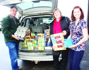 ANNUAL CONTRIBUTION TO SANTA FUND It that time of year again when people dig in to help out those in the community less fortunate, and Caledon Community Services (CCS) is pitching in again with the annual Santa Fund. And the effort received a big boost last week when Jim Rowland of Rowland Investments and Insurance Inc. and his wife Bente dropped off a whole carload of donated food at the Exchange in Bolton. Kim D'Eri, manager of community animation with CCS, was happy to help them unload. Rowland said as part of his company's five-star status, Manulife Securities will be matching the contribution. Photo by Bill Rea