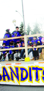 These members of the Caledon Bandits Lacrosse Club were waving at spectators as they passed by.