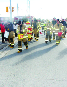 There were many groups passing out candy and other goodies along the parade route, including these Bolton firefighters.