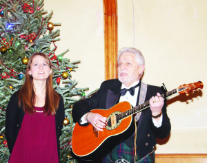 Liz Ward and her father-in-law Dave from Fergus were performing some of the songs of the season. Photos by Bill Rea