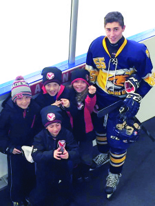 MEETING A GOLDEN HAWK Members of the Caledon Hawks RS Novice team got a chance to meet Caledon Golden Hawks' defencemen Shane Rumboldt before Sunday;s home game against the Midland Flyers. Rumboldt had team pucks for the young admirers. And to make things even better, the Hawks won their game. Submitted photo