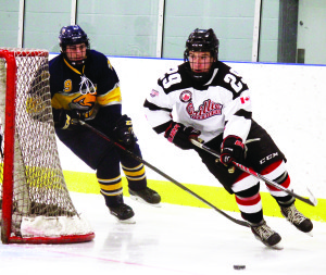 Caledon's Sean Nottle chases Orillia defenceman Marty Lawlor around the net in the Golden Hawks' 6-3 win over the Terriers Friday. Photo by Jake Courtepatte